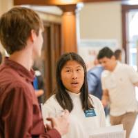 Annie (right) speaking to Harrison (left)